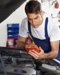 Mechanic performing diagnostics